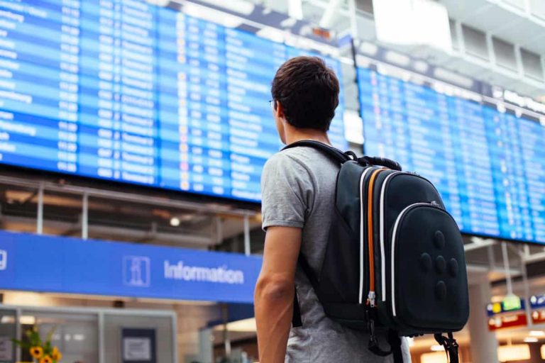 Man with a backpack on an airport