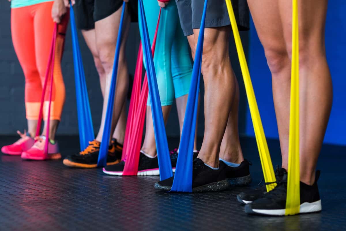group of people exercising with resistance bands