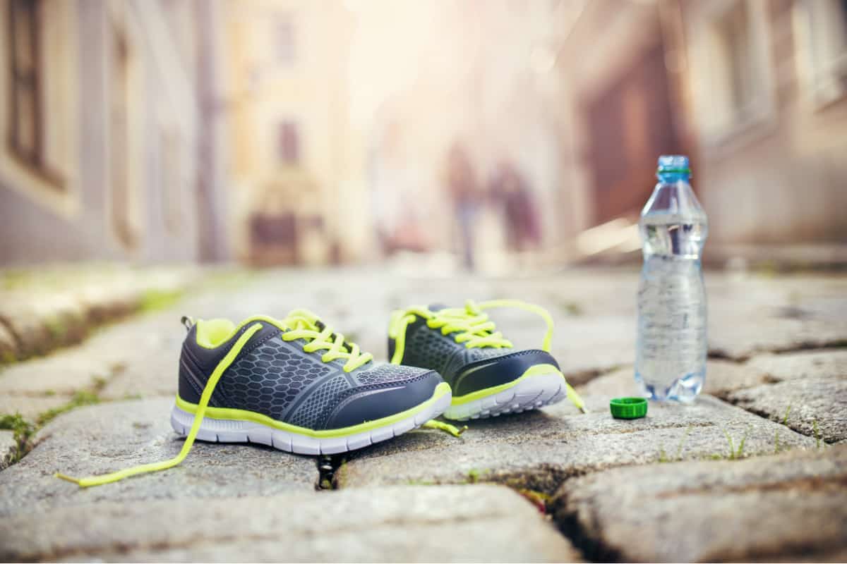 running shoes and bottle of water