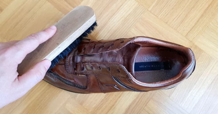brushing a brown leather shoe 2