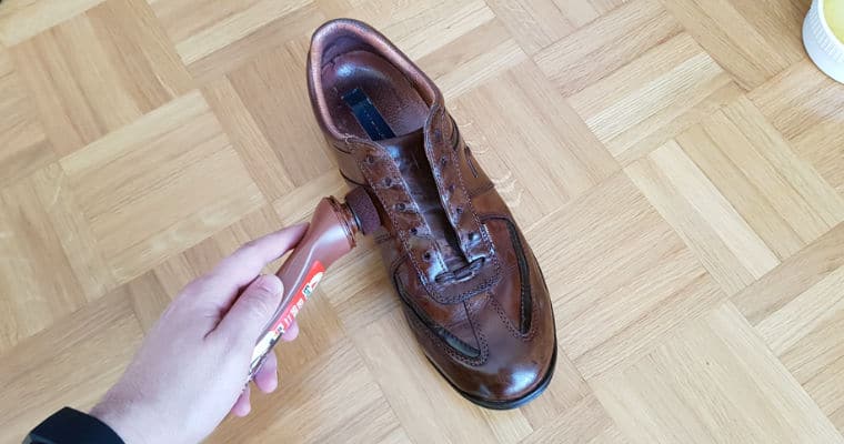conditioning a brown leather shoe