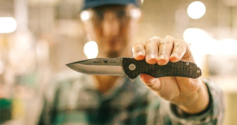 Man holding a buck knife