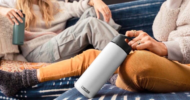 Woman holding a Camelbak water bottle