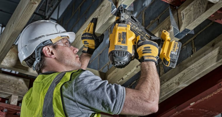 Man using a DeWalt nail gun