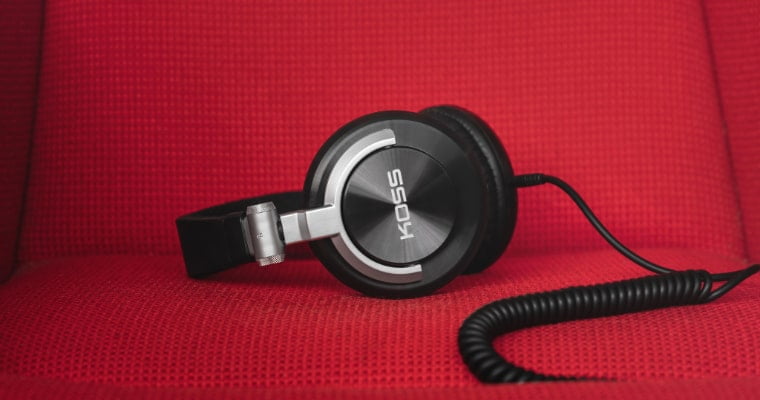 Koss headphones on a red sofa