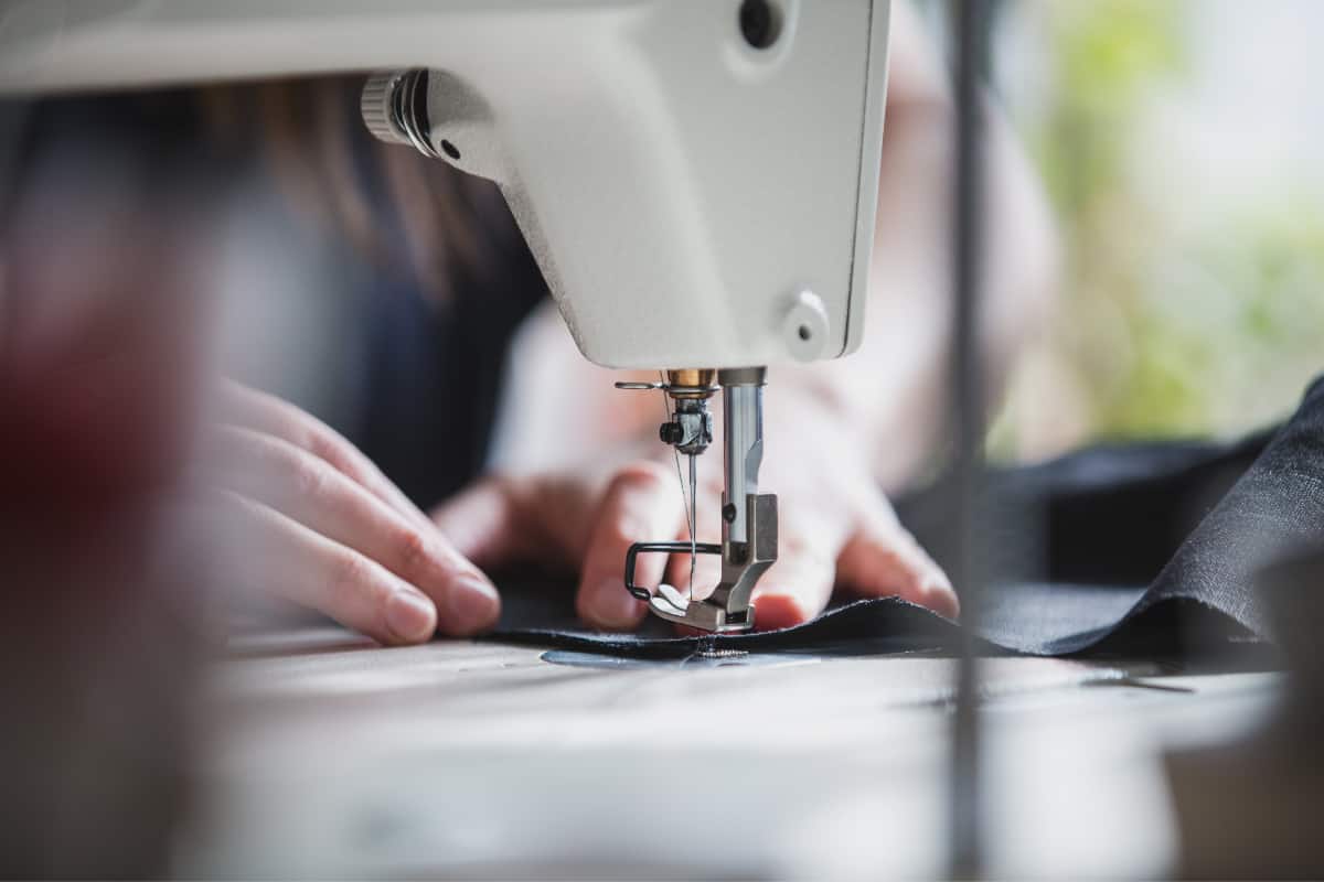 Woman hands sewing with a sewing machine
