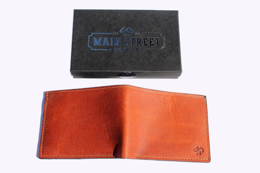 The back of Main Street Forge Leather Bifold Wallet (Tobacco snakebite brown)