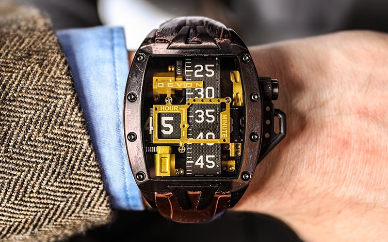 man's wrist with a devon works watch