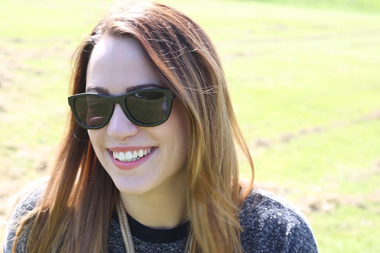 A young woman wearing Bambooka sunglasses