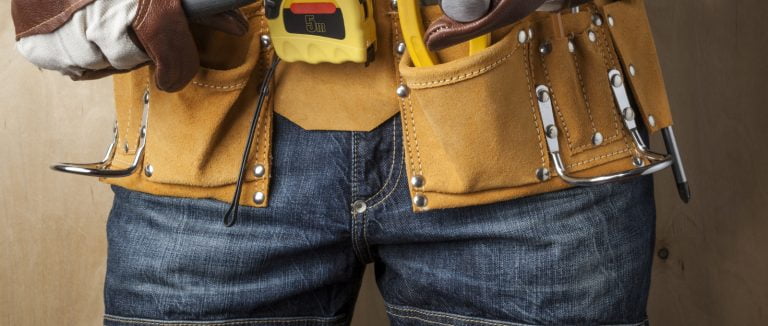 professional in jeans with work tools