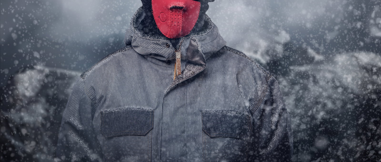 Portrait of a snowboarder dressed in a full protective gear
