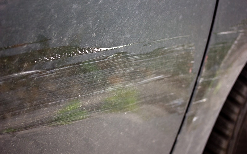 black paint door with scratches