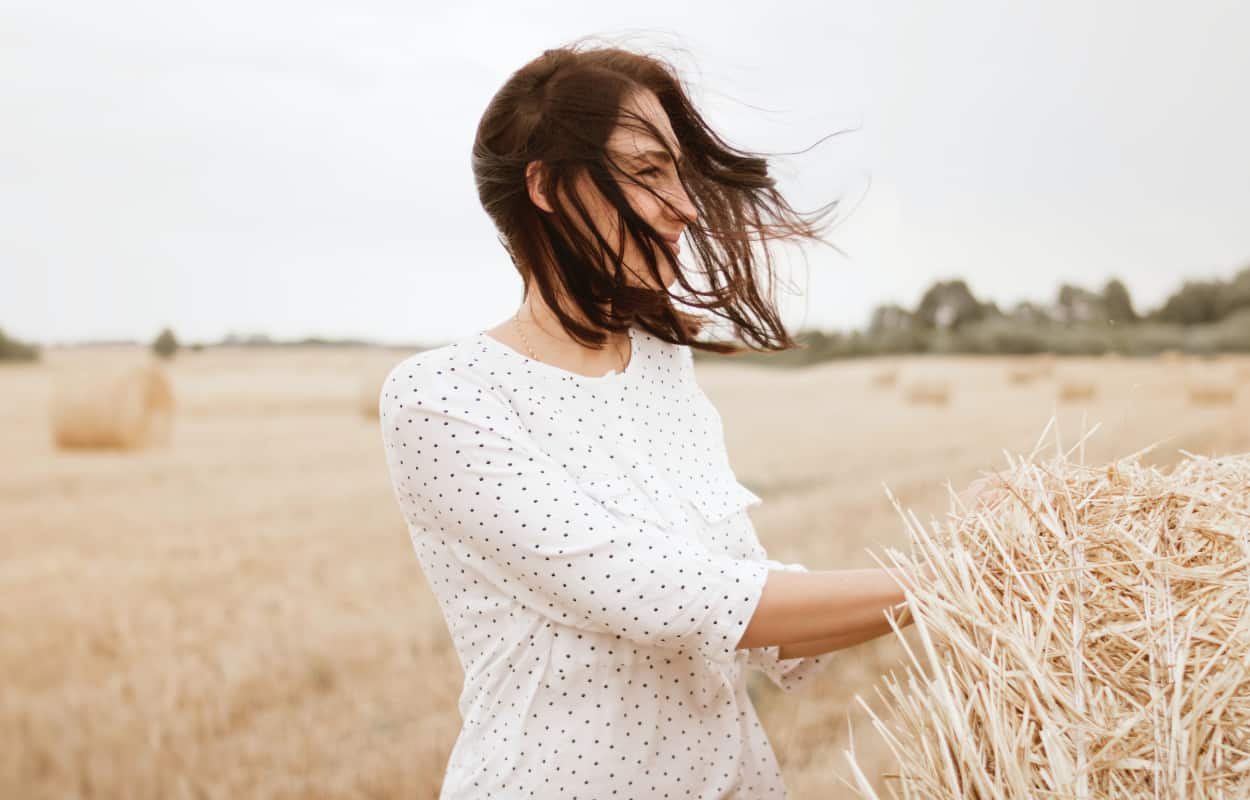 woman posing on a field