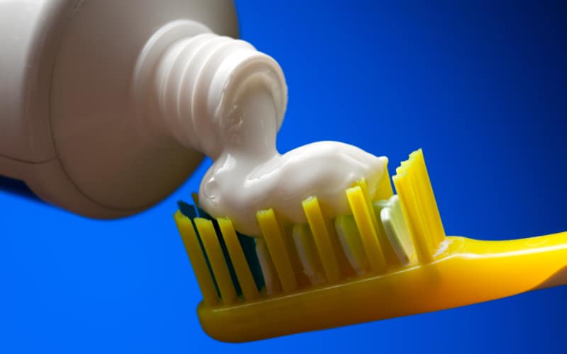 white toothpaste on toothbrush