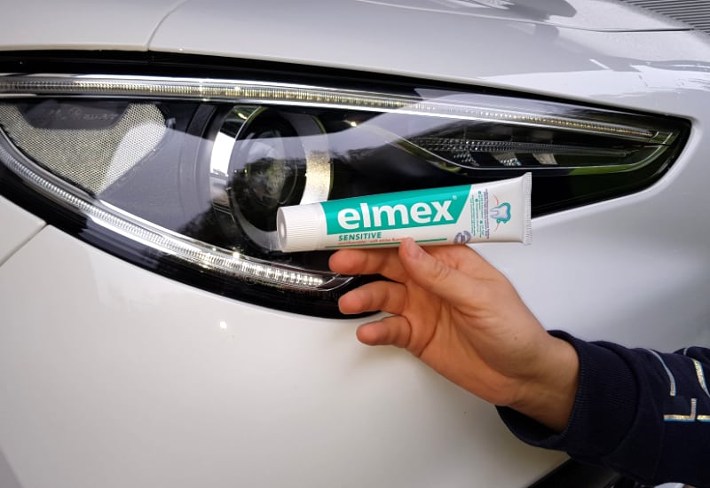 cleaning headlights with a toothpaste