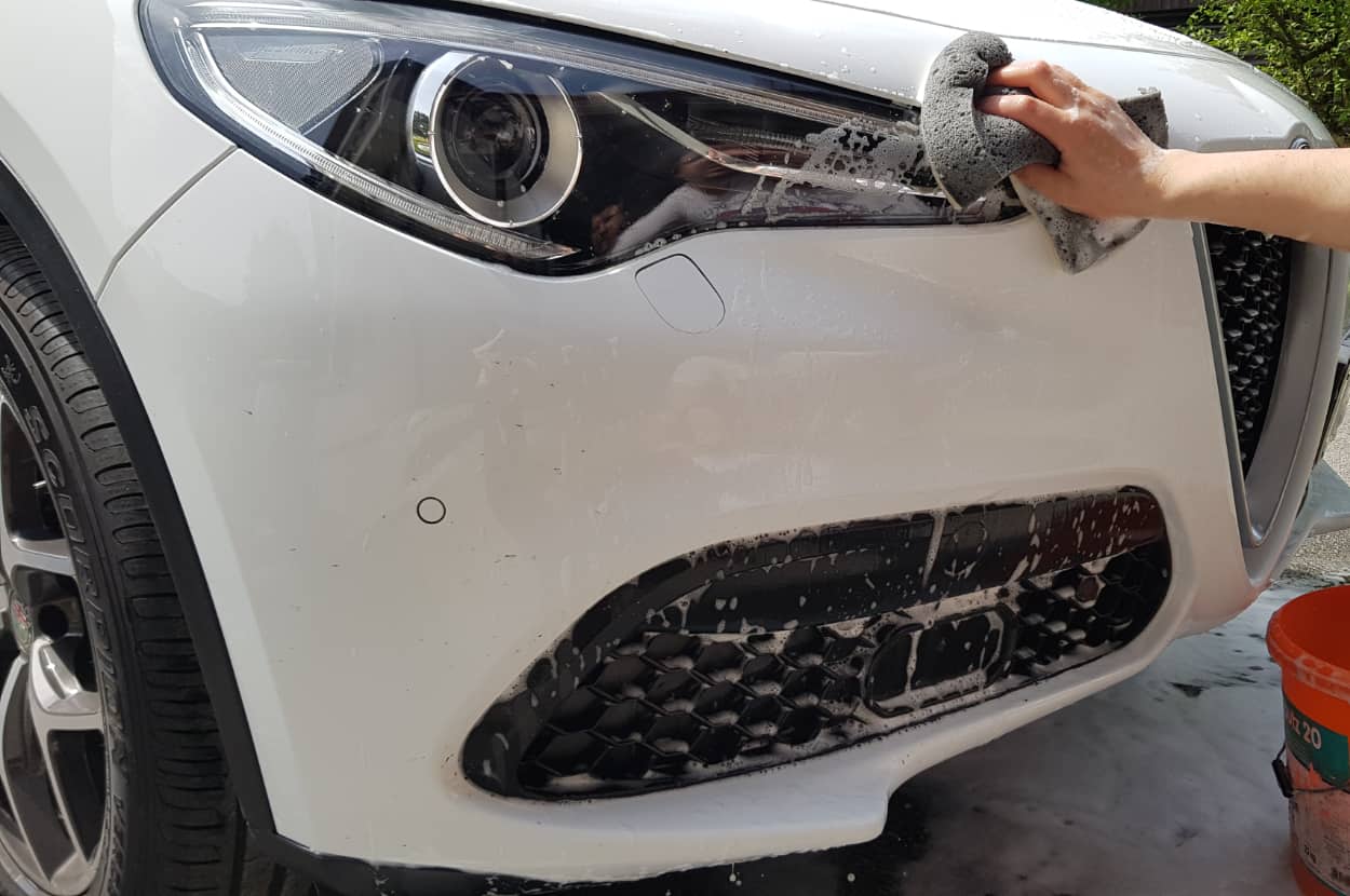 washing headlights on ar with soap and water - feature image