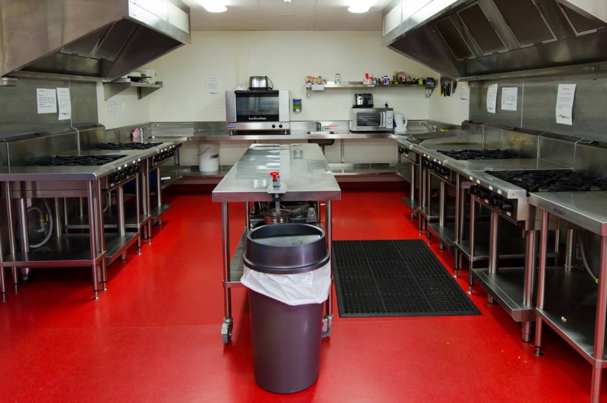 professional kitchen with a red floor