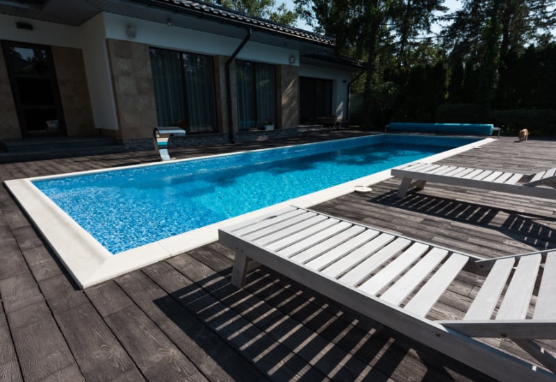 house exterior with a swimmig pool