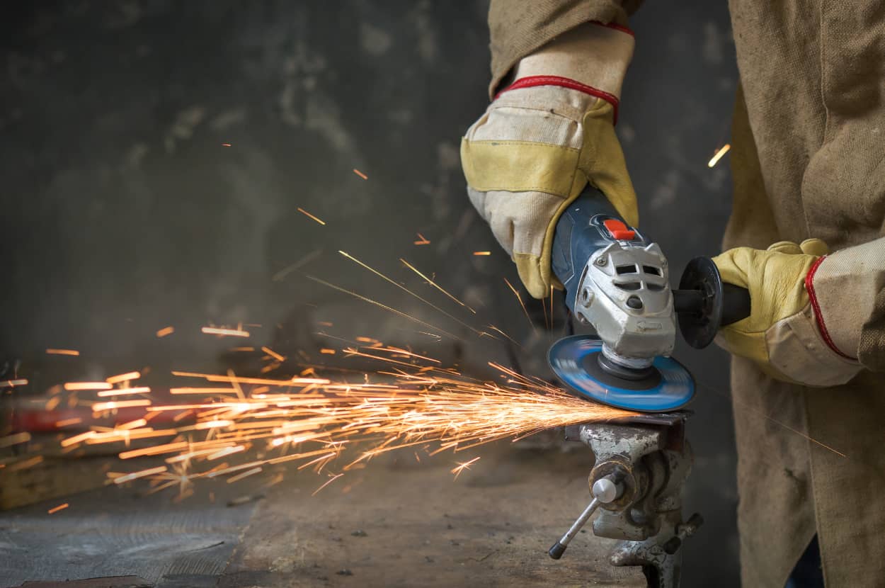 man using an angle grinder