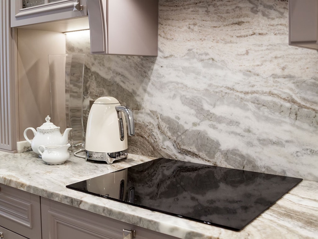 Kitchen with quartz countertop and backsplash