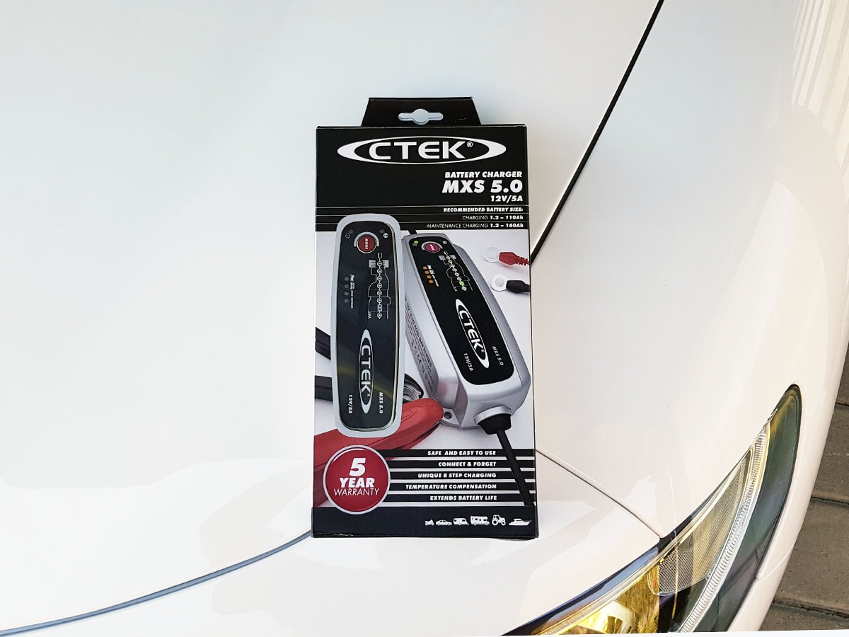 CTEK MXS 5.0 on the hood of white Alfa Romeo Stelvio