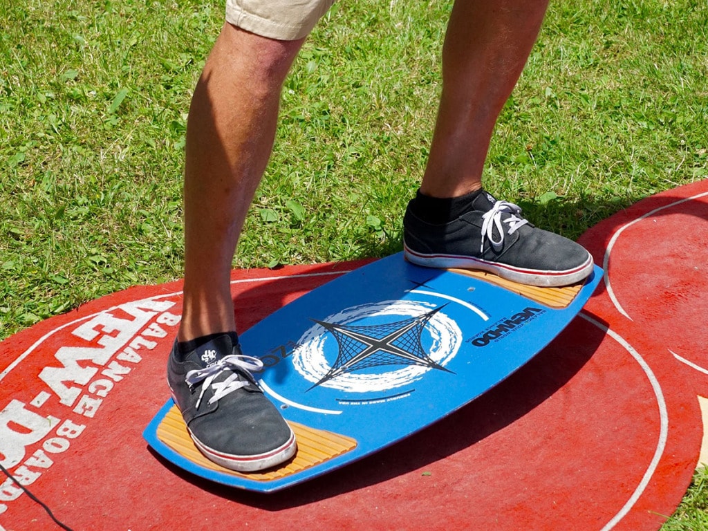 Exercise balance board with mat on grass