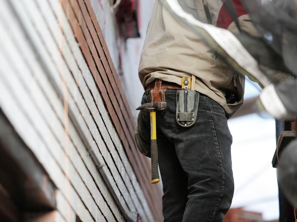 Construction worker wearing jeans