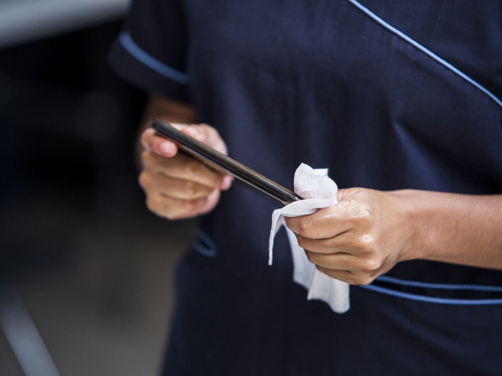 Hands cleaning phone