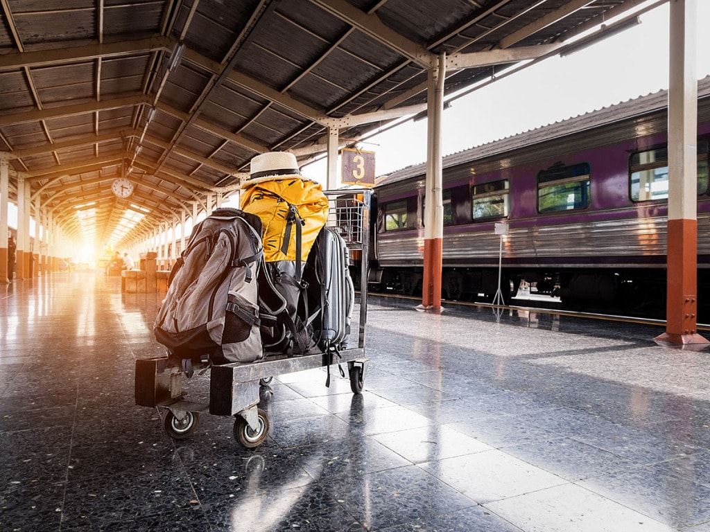 Luggage on trolley in train station