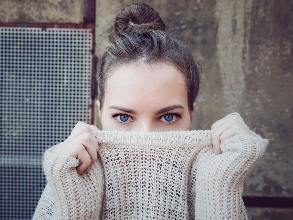 Woman wearing loose knit sweater